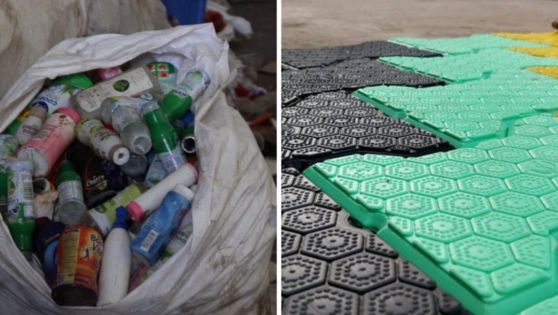 Father and son (6-8) recycling plastic bottles, smiling Stock